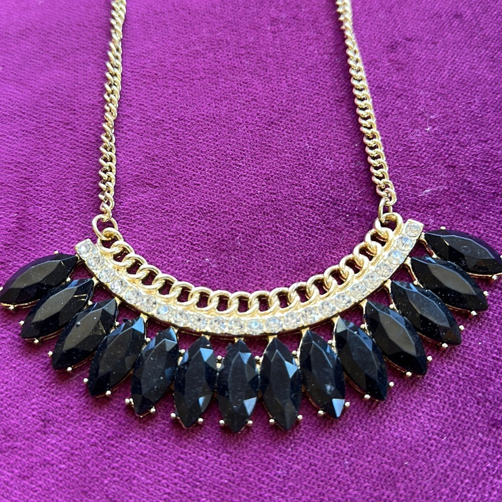 gold clear and black stones